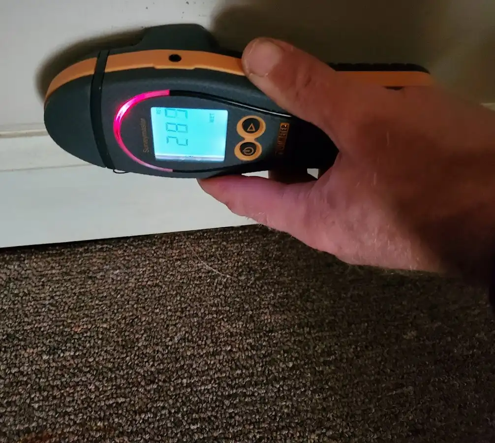 Moisture detection at baseboard during Burst Pipe Cleanup in Somers
